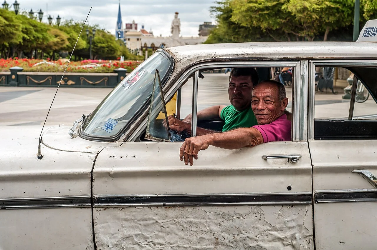 A shared taxi in Maracaibo shows why transport comparisons should include the mode people actually use, not only a generic line item.