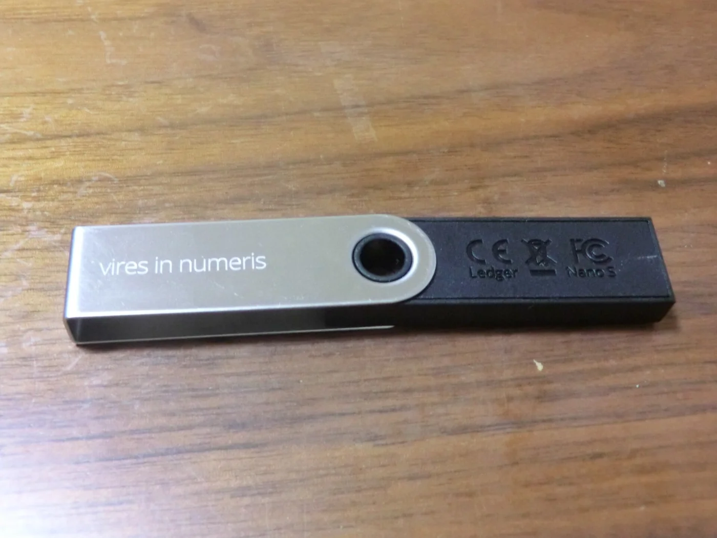 A Ledger Nano S hardware wallet provides a concrete visual for the glossary’s wallet and custody terminology.