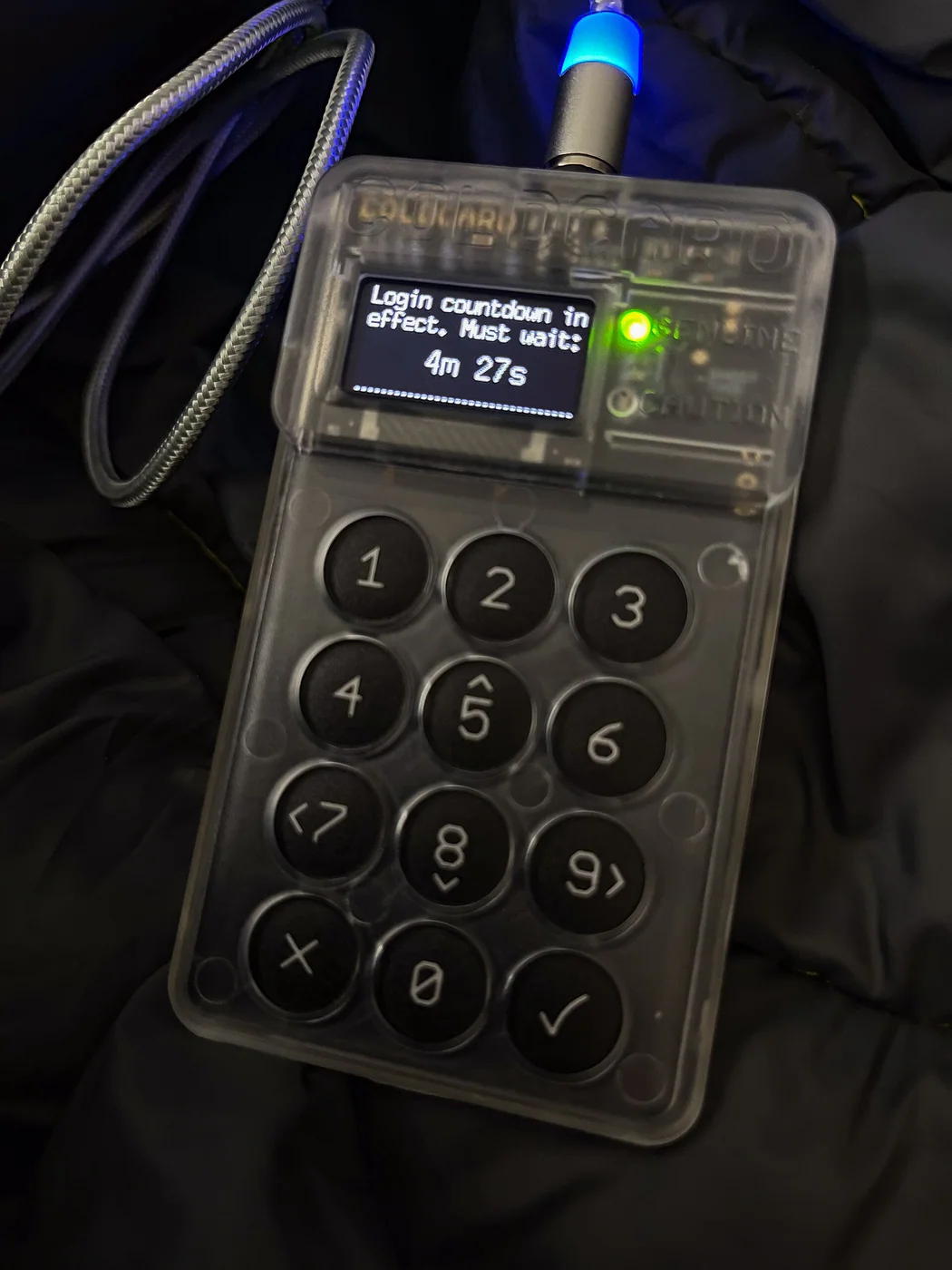 A Coldcard hardware cryptocurrency wallet illustrates key-management hardware
