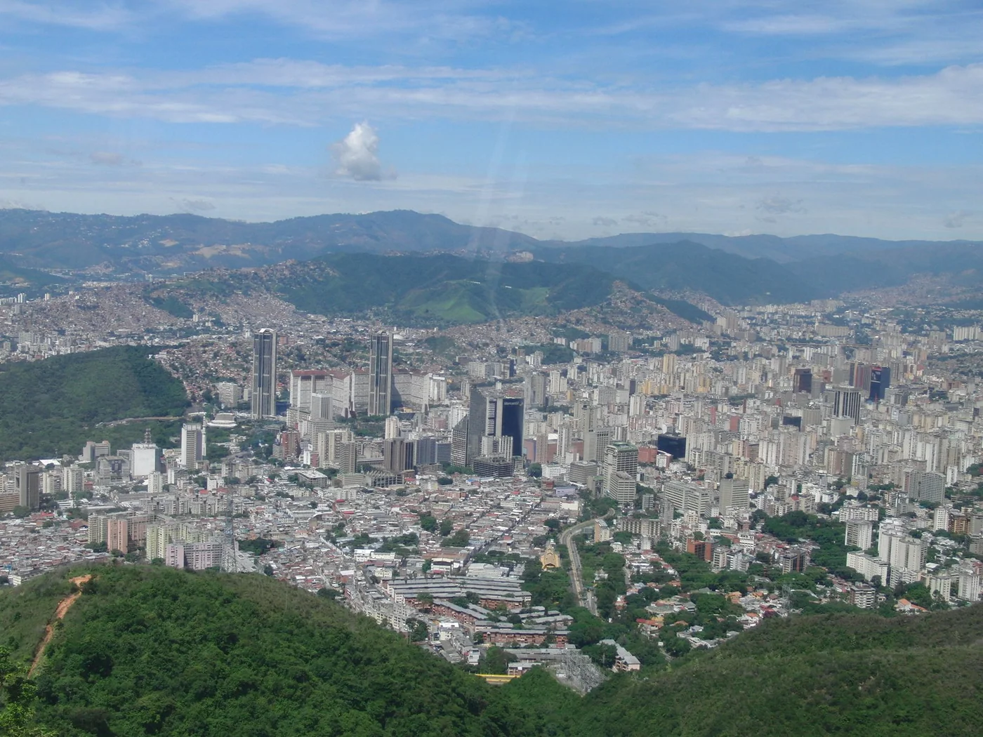 Caracas viewed from El Ávila, with the valley and mountain ridge visible.