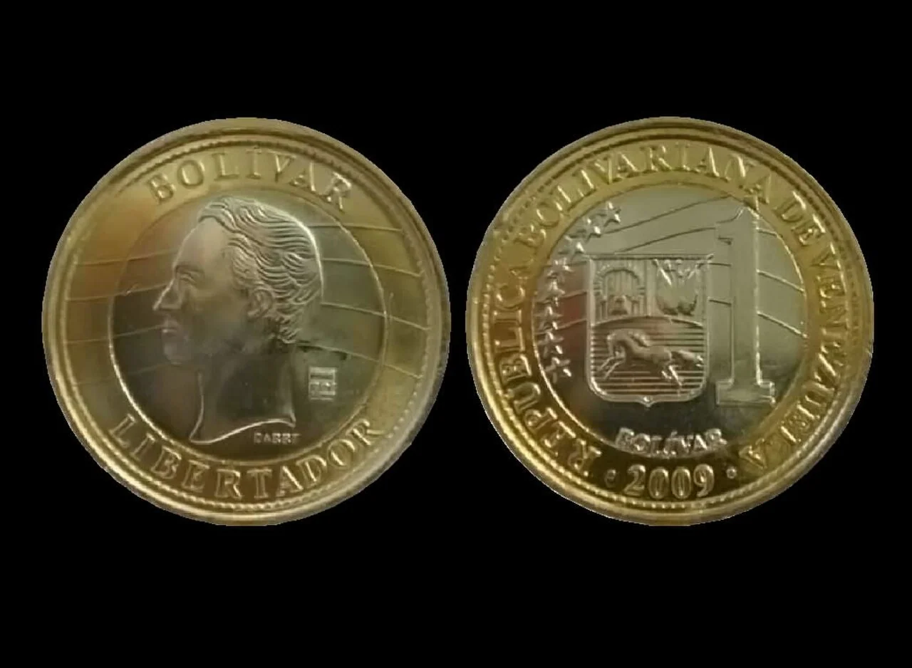A 2009 Venezuelan bolívar coin shows the official currency continuing alongside dollar pricing.