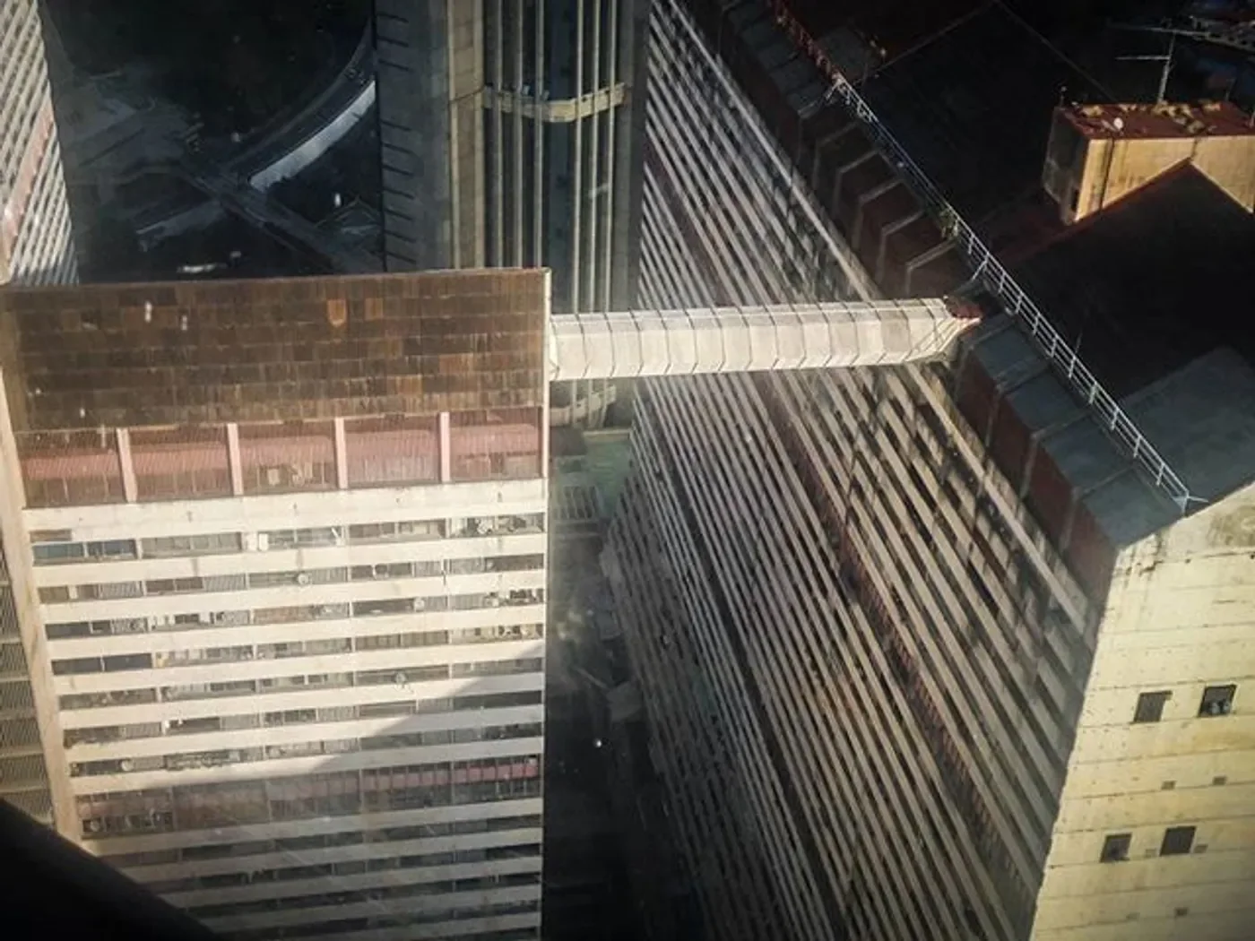 500px provided description: Parque Central Caracas Venezuela 1 [#city ,#downtown ,#reflection ,#window ,#urban ,#architecture ,#building ,#industry ,#skyscraper ,#glass ,#grey ,#office ,#construction ,#structure ,#venezuela ,#business ,#no person ,#Photography ,#Parque Central]