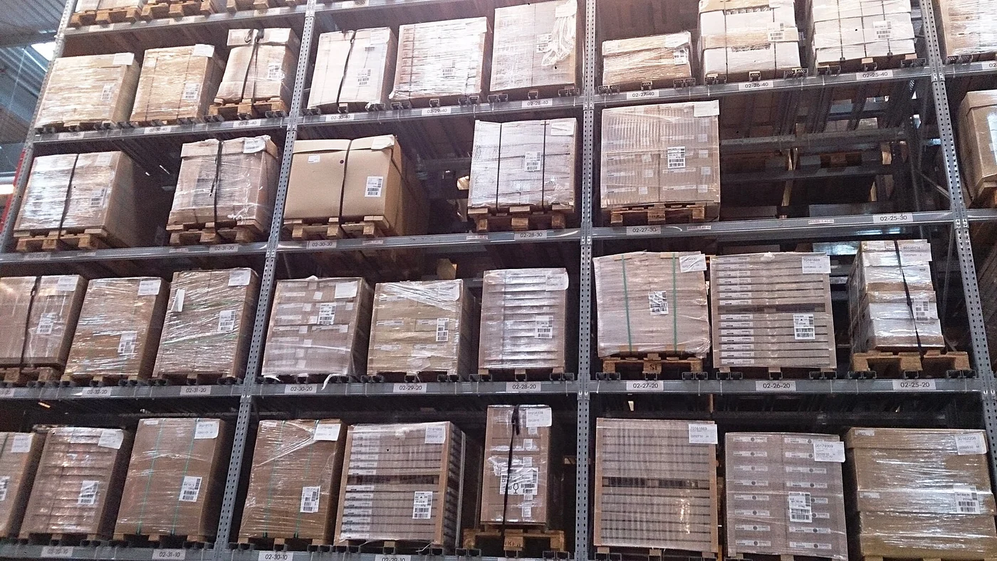 Crates stacked in a warehouse in Singapore; illustrative of stock storage, not a Venezuelan warehouse.