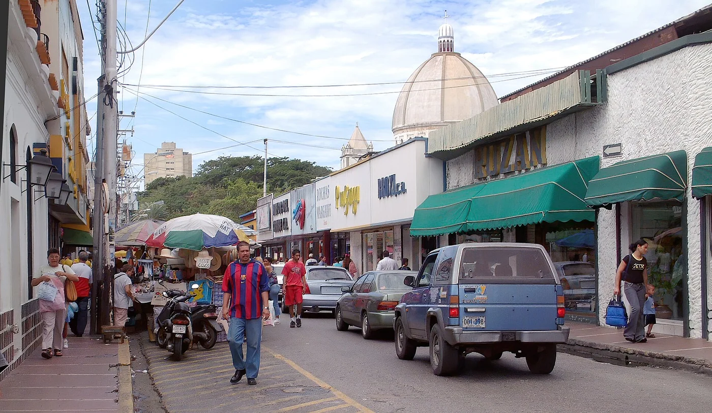 Busy commercial scene on Calle Velásquez in Porlamar, Margarita Island, Venezuela.