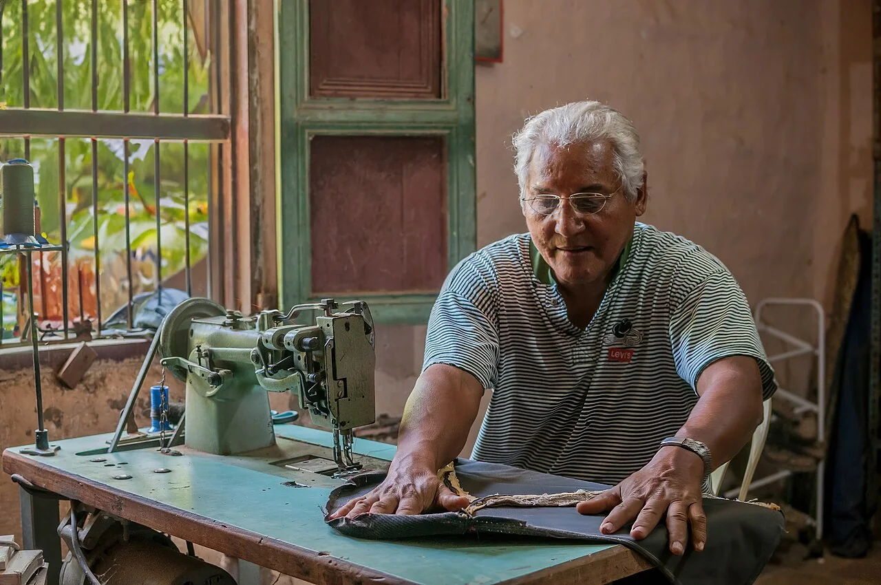 An upholsterer working at home on Margarita Island, Venezuela.