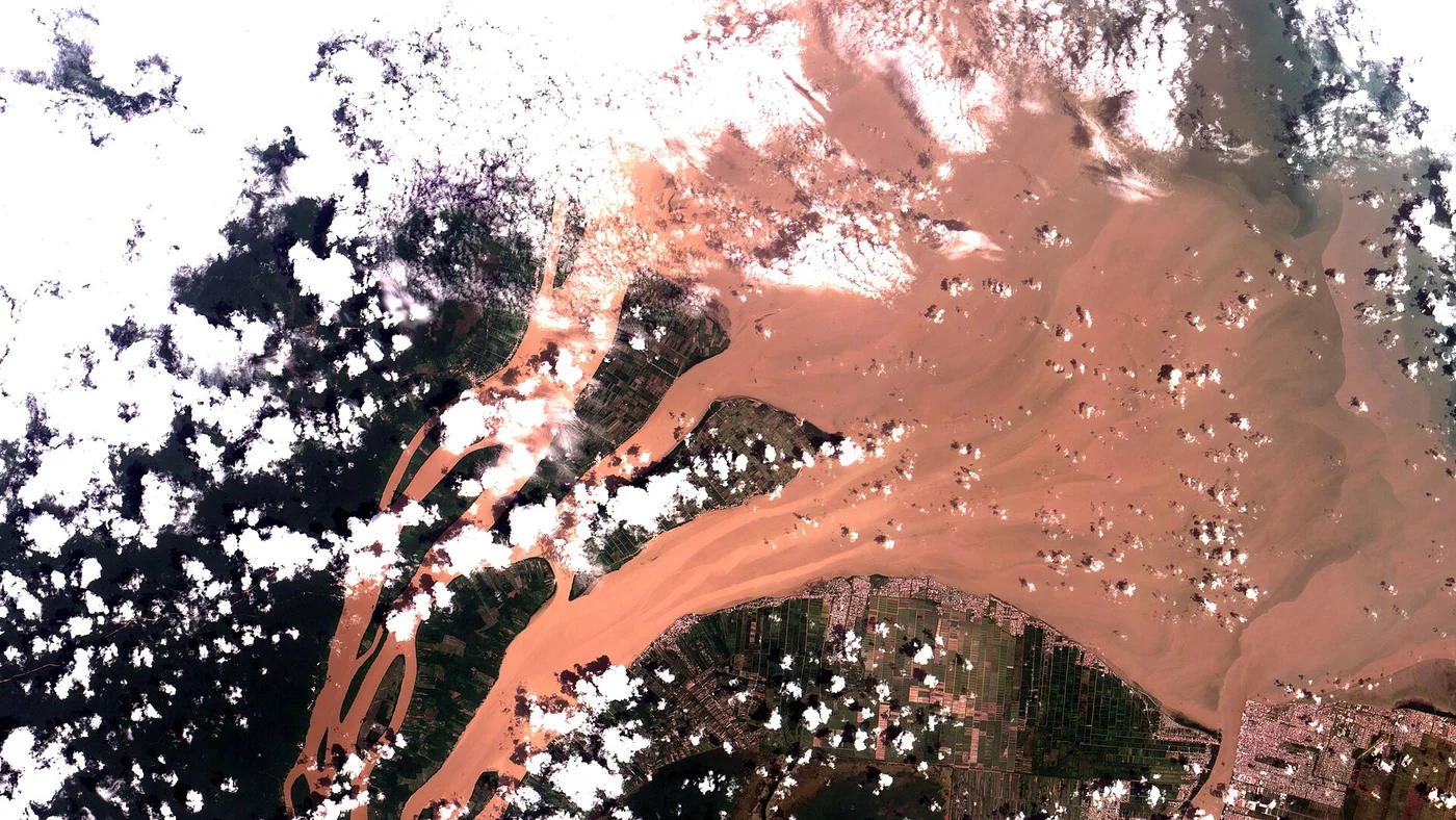 Satellite image of the Essequibo River mouth on Guyana’s Atlantic coast, showing the delta and coastal landscape.