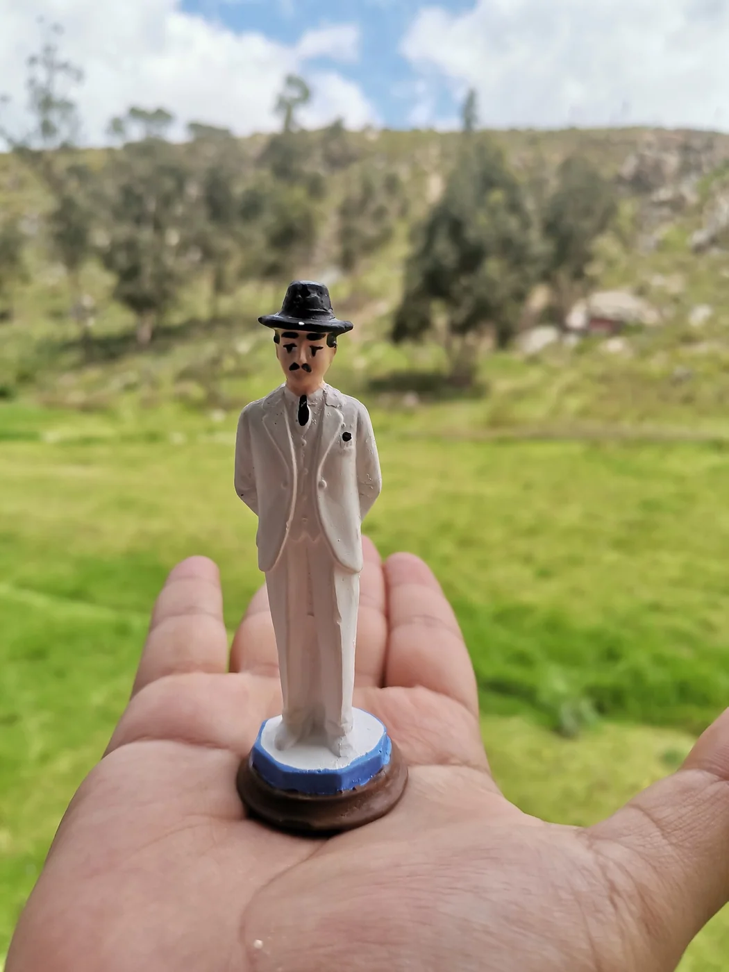 Small devotional representation of José Gregorio Hernández, photographed as a local religious object.