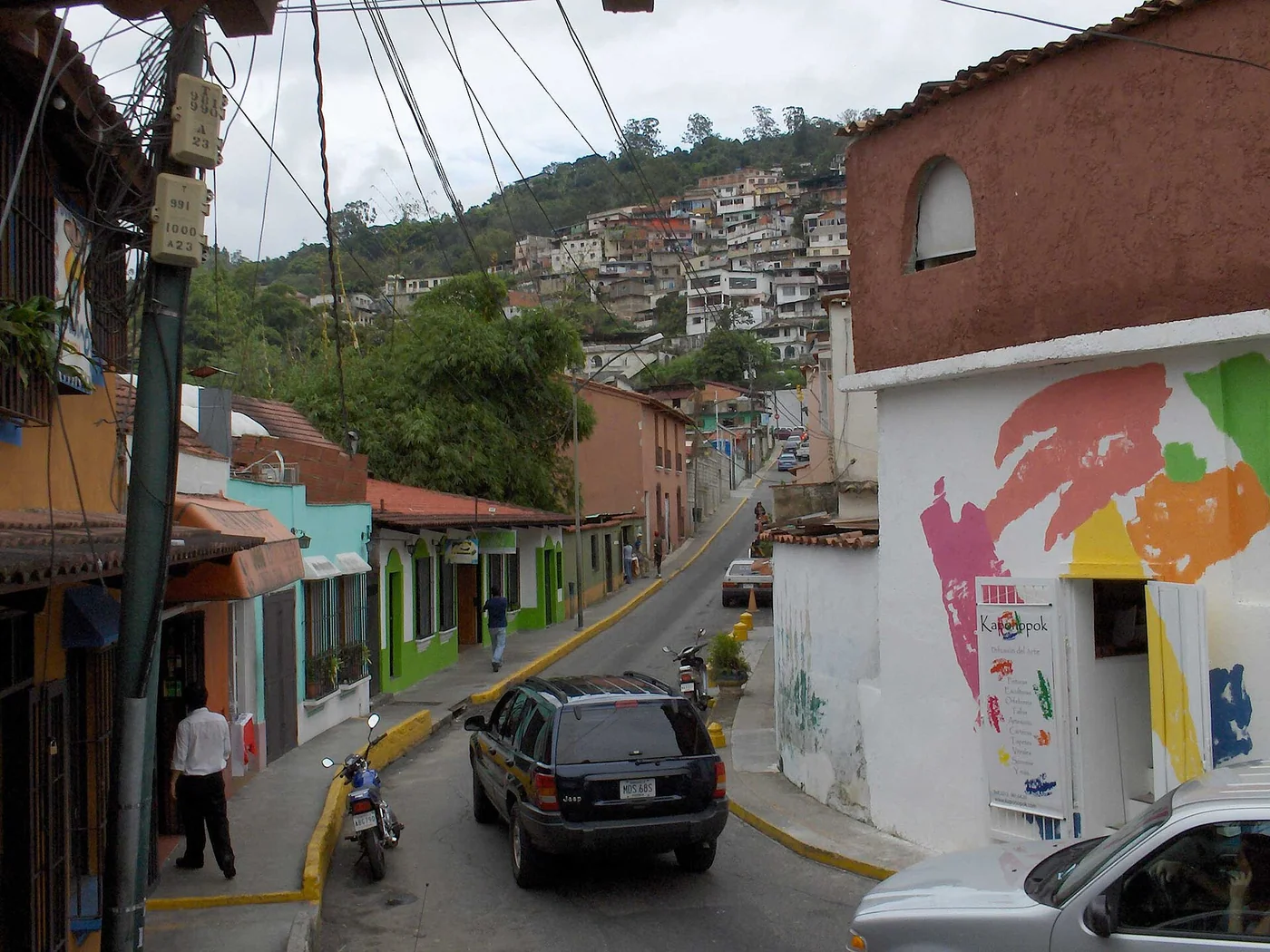 Colorful street in El Hatillo, Caracas, rising toward a hillside neighborhood.