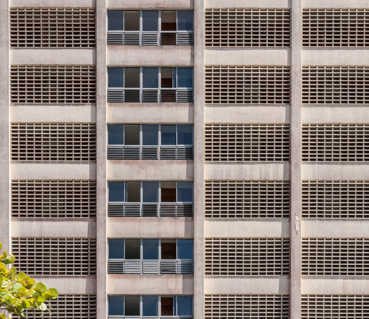 Breeze-block facade and windows of a high-rise building in Porlamar, Margarita Island.