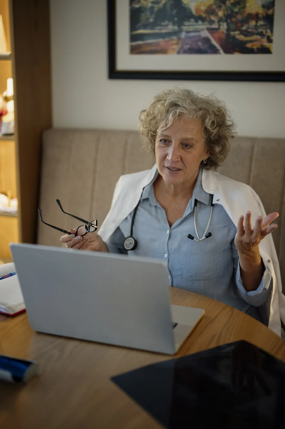 Doctor speaking with a patient during a video consultation at home