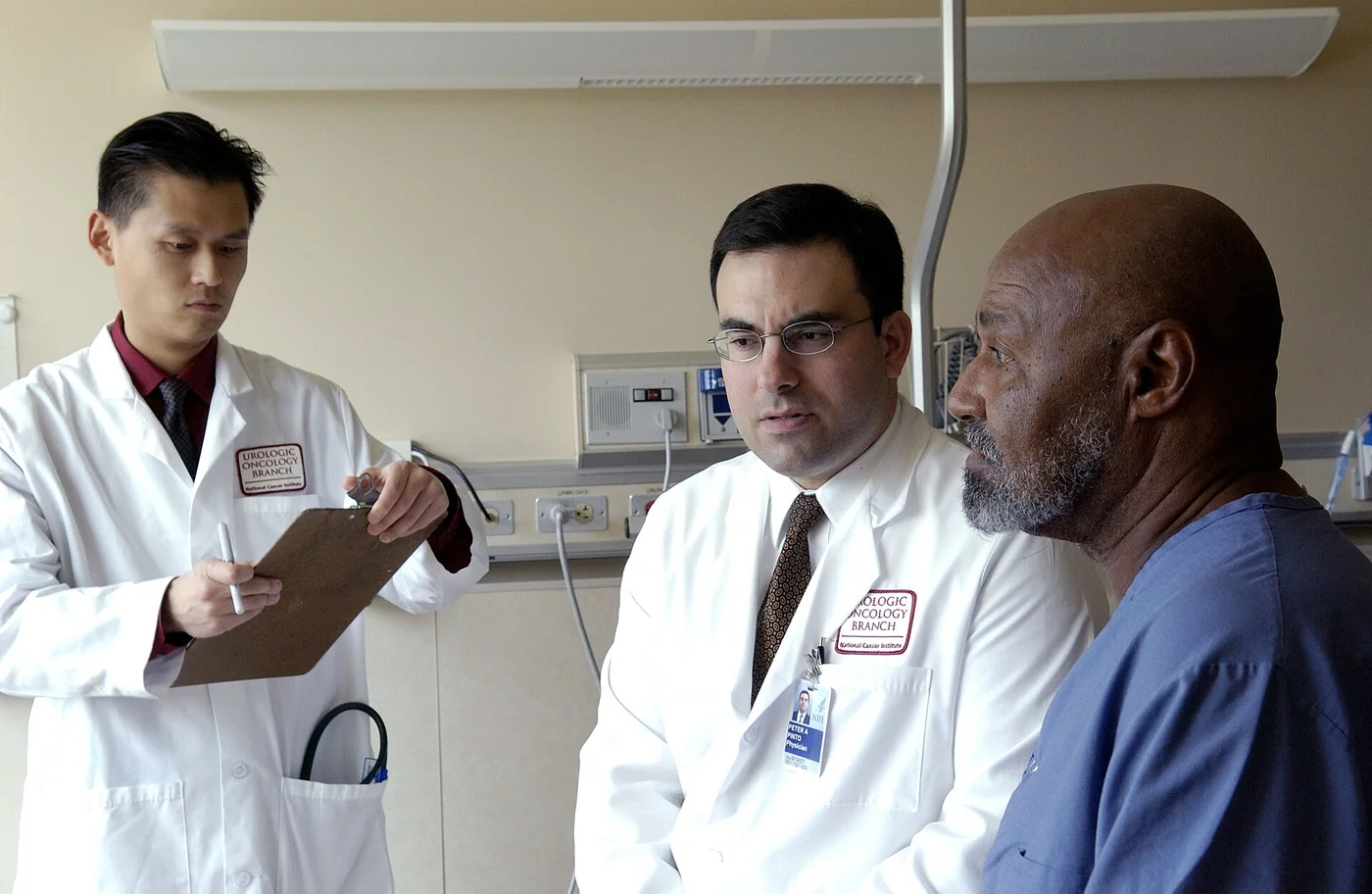 National Cancer Institute doctor consulting a seated patient