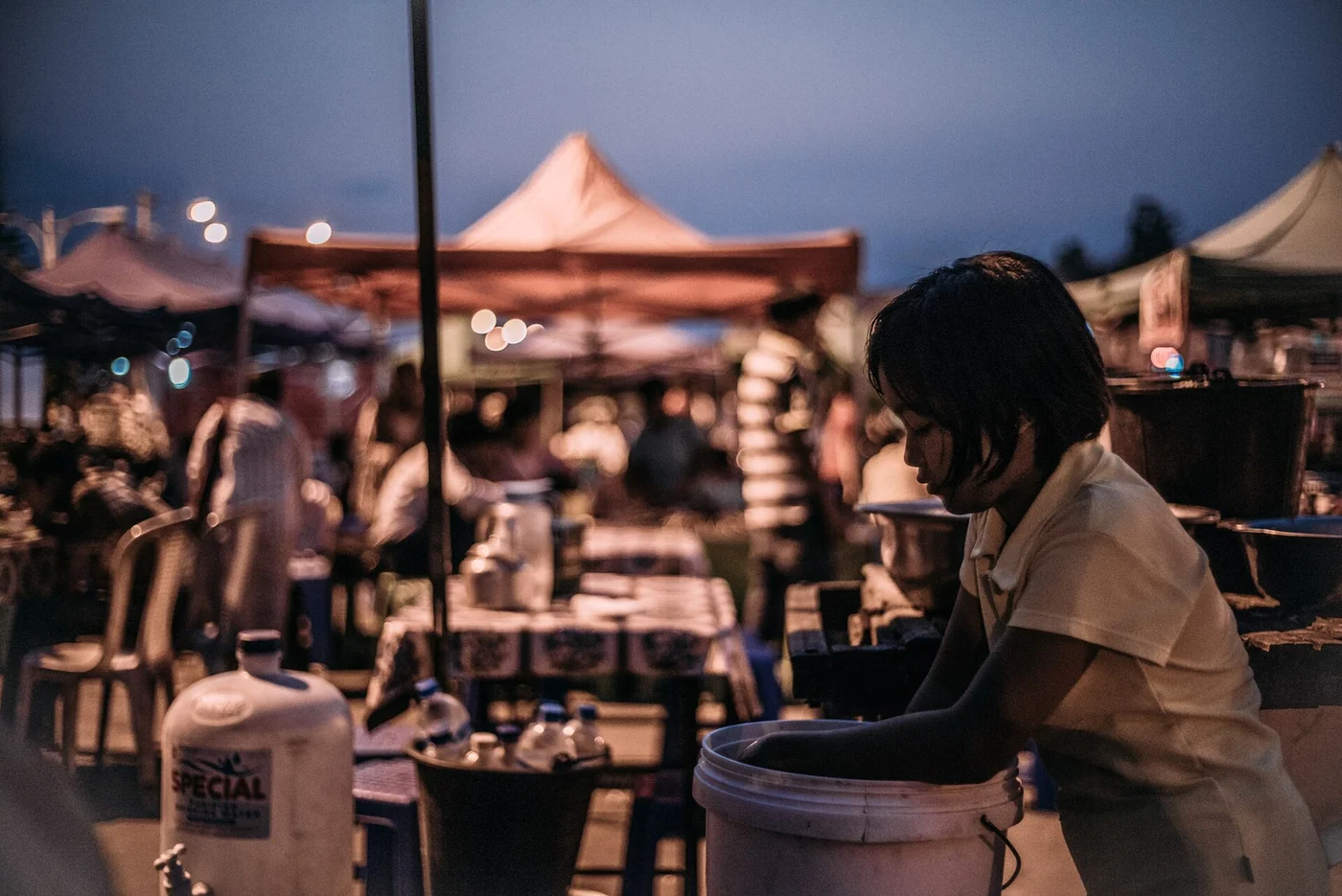 500px provided description: child washes dishes in family restaurant in Naypyitaw, Myanmar [#WHA Myanmar Naypyitaw]