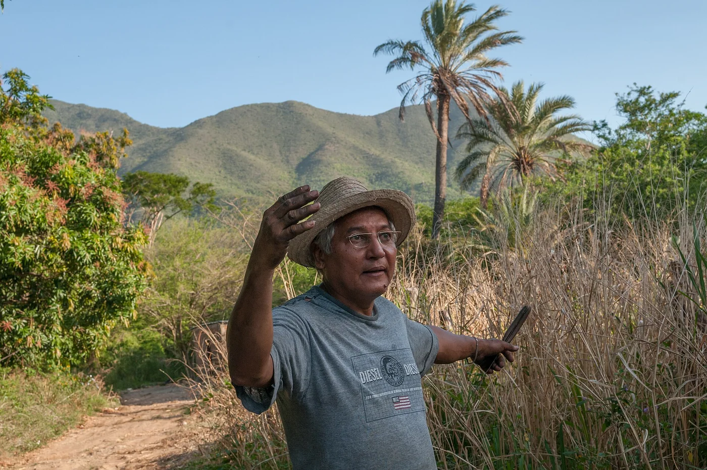 Older man beside a rural path on Margarita Island.