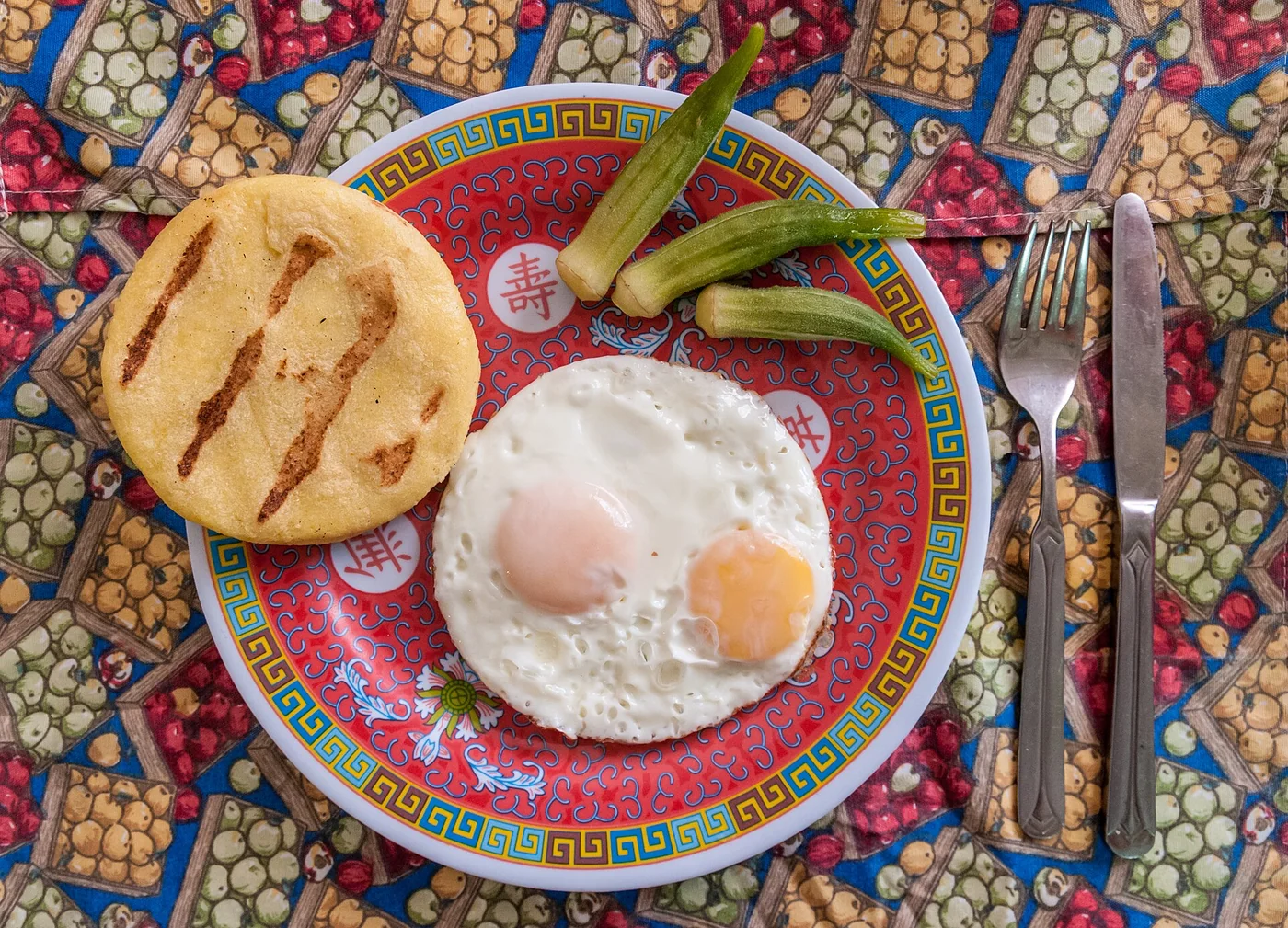 Typical Venezuelan breakfast with arepa and eggs.