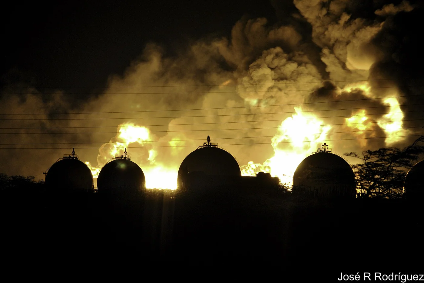 Gas-storage spheres and a flare viewed from Judibana near the Amuay refinery complex.