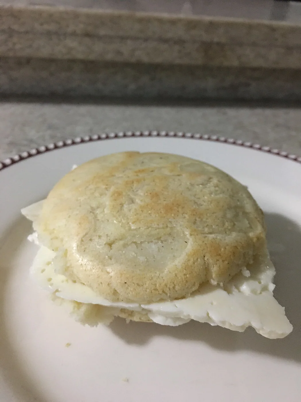 This is an arepa filled with queso llanero (Venezuelan white cheese)