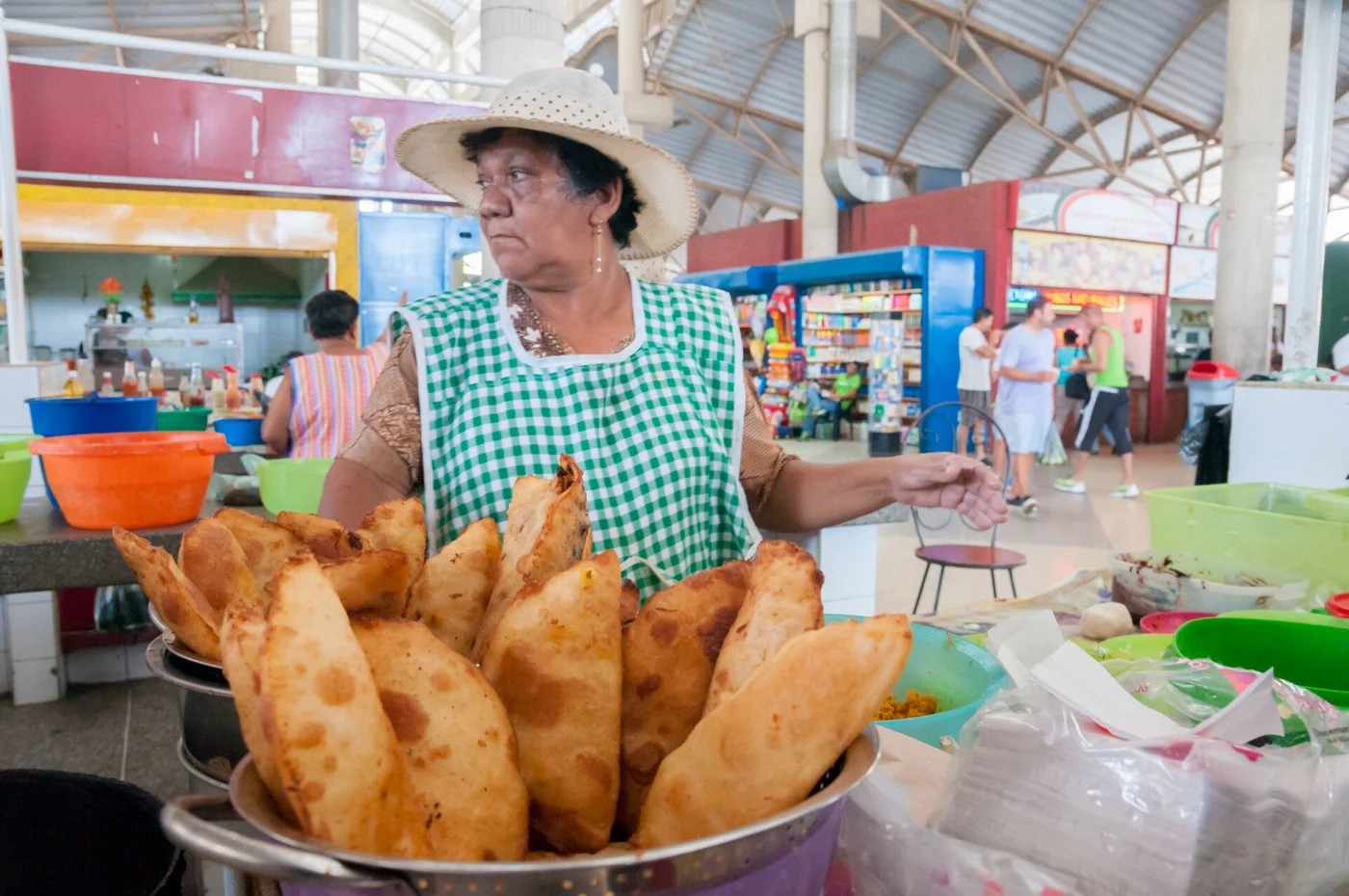 A woman selling empanadas at the Mercado de Conejeros in Porlamar, the largest market of the island. Margarita Island, Nueva Esparta, Venezuela.