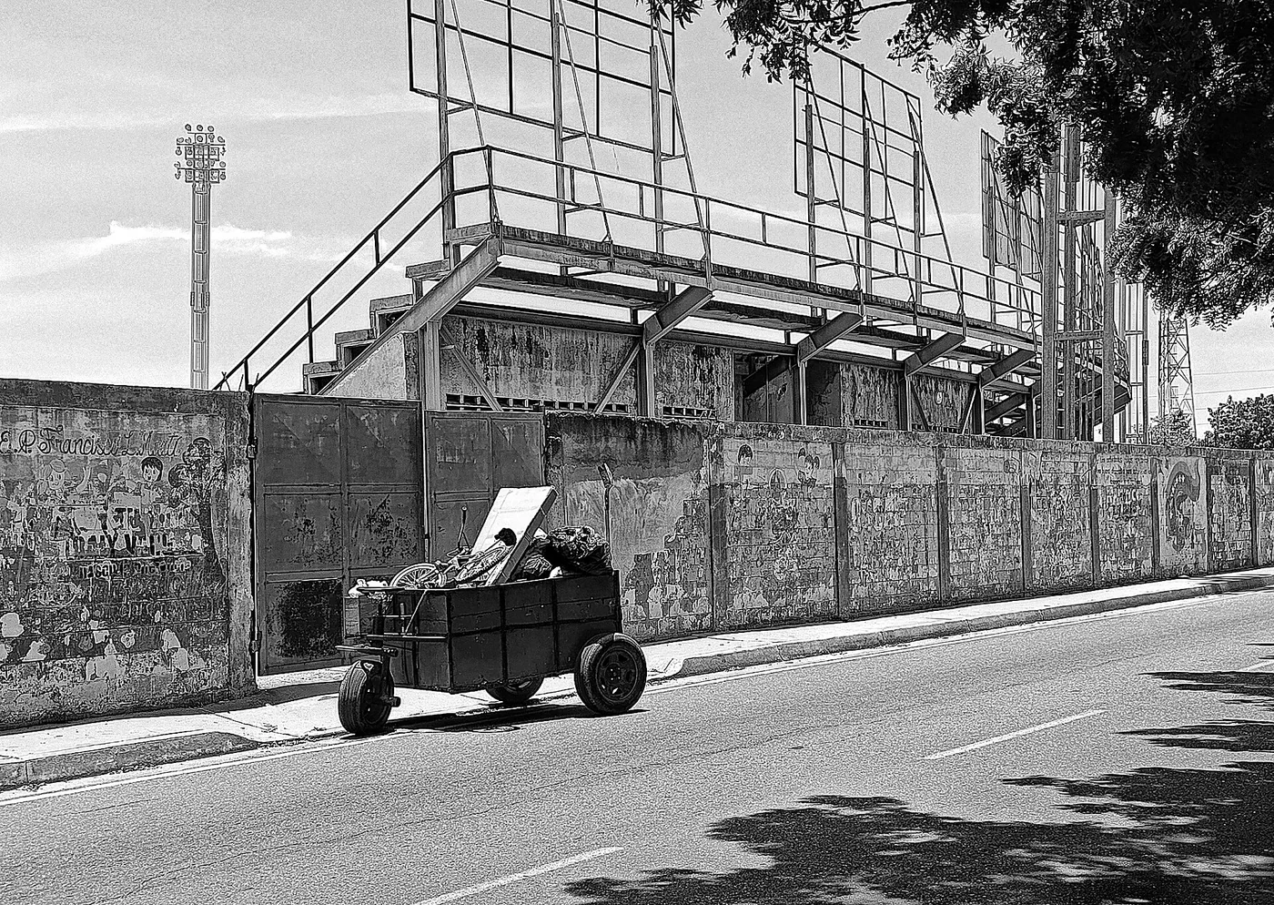 Handcart beside a sports-ground wall in Maracaibo or Cabimas, Venezuela.