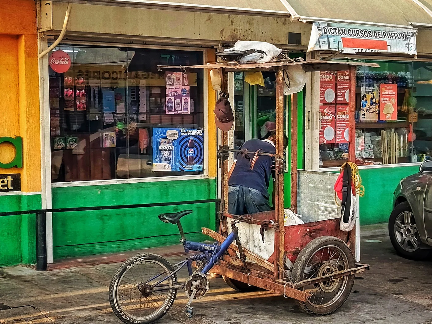 Colorful neighborhood kiosk and handcart in Maracaibo or Cabimas, Venezuela.