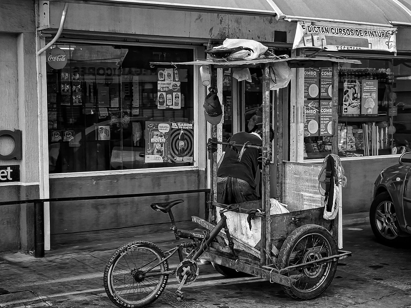 Neighborhood storefront and handcart in Maracaibo or Cabimas, Venezuela.